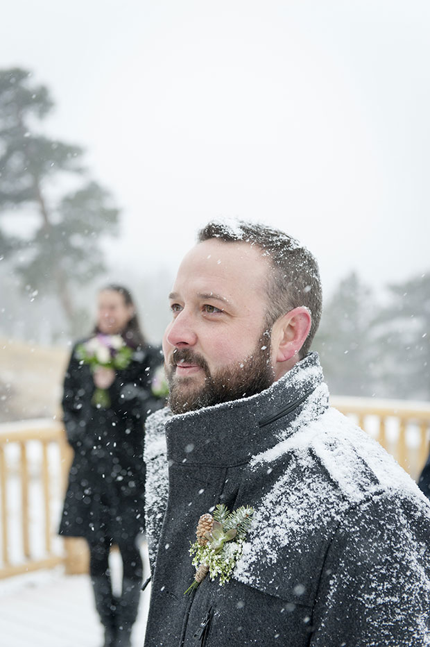 Nick watching Chrissy come down the aisle