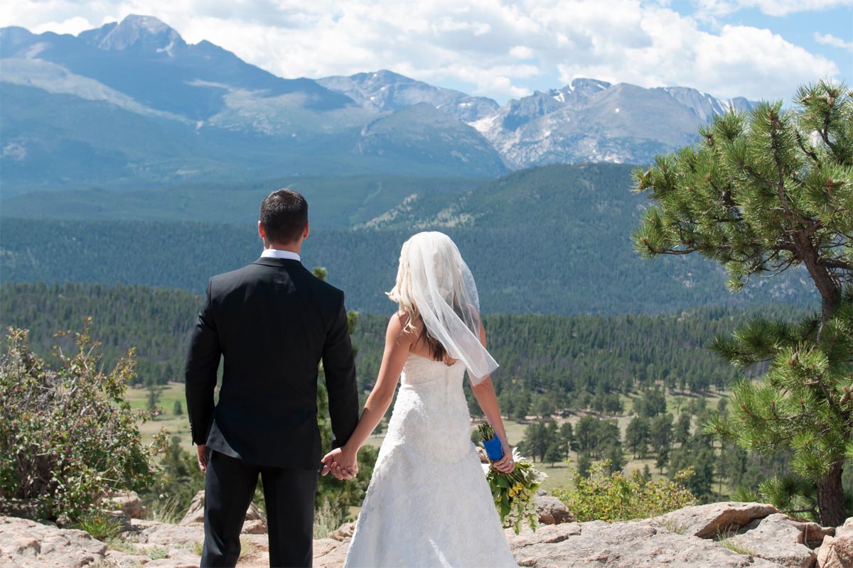 Jason and Katie celebrating with the mountains in the background
