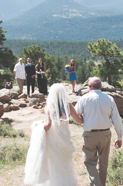 Katie walking towards Jason with her dad